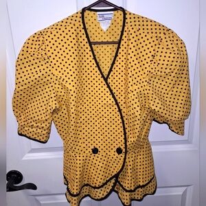 A vintage Avon Fashions wrap around top in a size 10. It's in like new condition